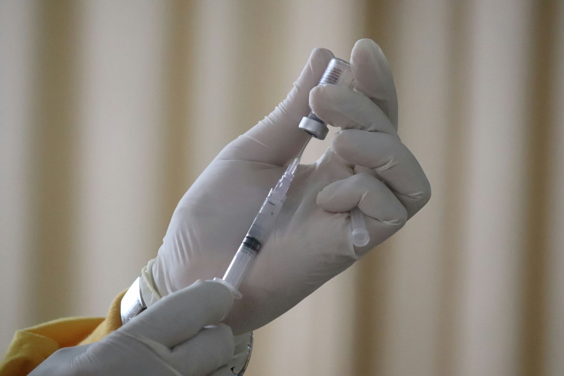 Nurse drawing an injection