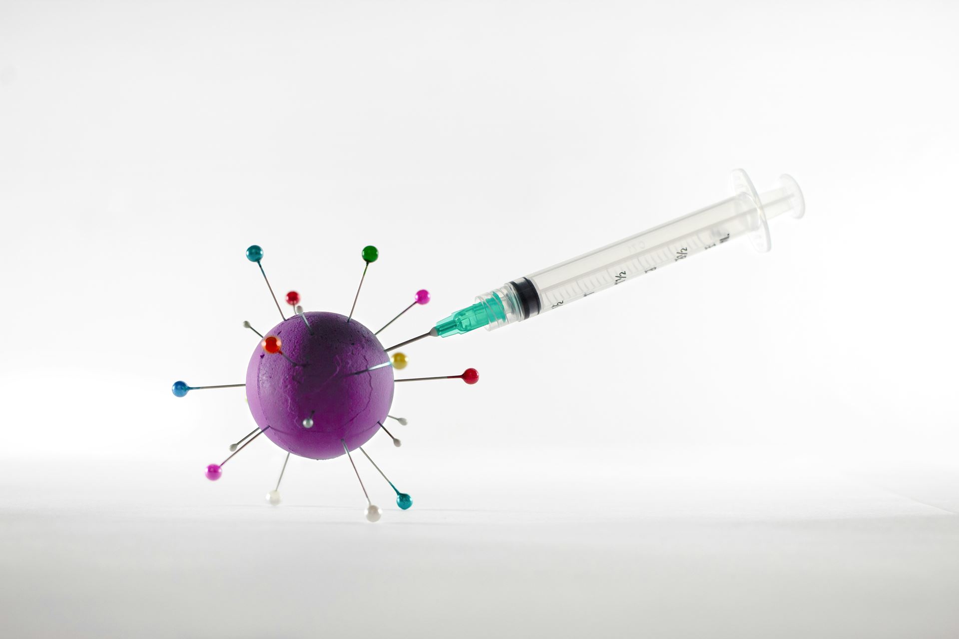 Injection being placed into cartoon virus