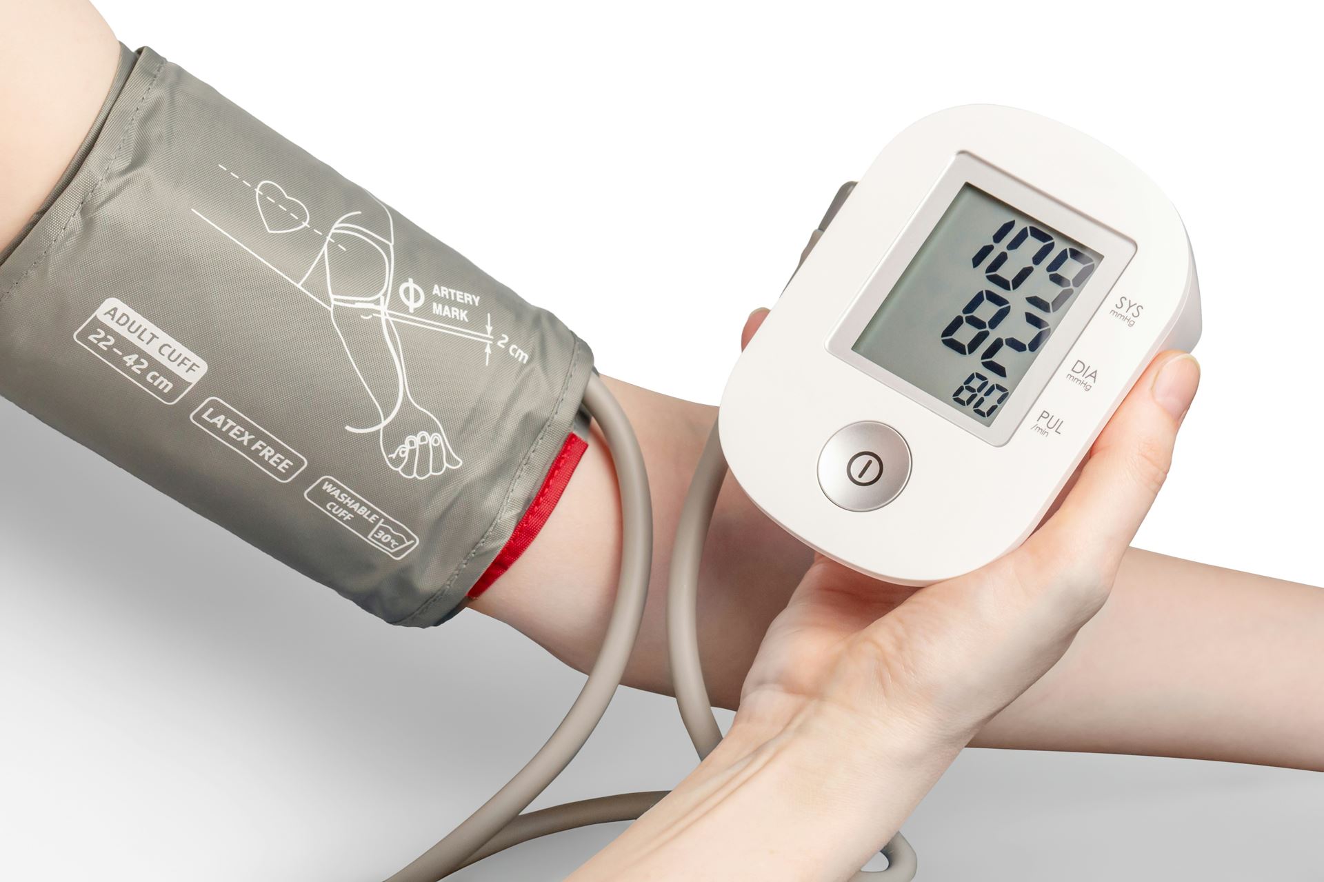 Person taking their blood pressure reading